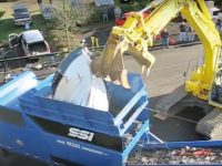 Mobile shredders like this one reduce fiberglass boats to a product that can be easily transported, and possibly re-purposed. Photo Courtesy SSI Shredding Systems.