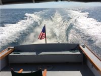 The view from the stern: Muscobe with all systems go, putting miles behind her on a day featuring sunshine and clear visibility. Photo by Joel Gleason.