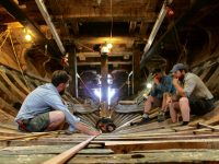 Photo courtesy Mystic Seaport MuseumMayflower II shipwrights use a batten to ensure new components match what's already there.