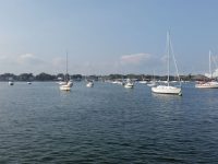 The view in Salem Harbor, and (inset), on Derby Street, a creepy example of the things that supposedly inhabited the town in the 1600s. Photo by Marilyn Pond Brigham