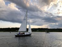 Photo by Tom BelcherGood Buddy glides through a serene Essex Harbor. Wind and waves? She likes those, too, as I recently discovered.