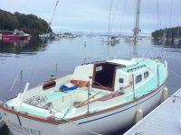 Photo courtesy Ben SteeleSpencer and Tess on the bow in Seal Bay, Maine (above), and Gannet waiting for her boom during commissioning. The aqua-colored decks have a distinctly 1960s feel.