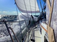 Photo by Mike MartelFinally freed from the confines of the canal, Acadia, a Pacific Seacraft 40, gallops south in a crisp norther.