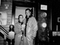 Above: Still in their foul weather gear a year after their ordeal, Peg and Tom  celebrate their official engagement at the Winslow Homer Studio in Prouts Neck, Maine. PegÕs grandfather, Mort Pratt, took the picture.