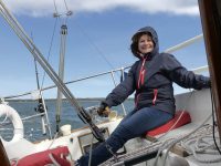 The author's "new" boat, Mojo, and (inset) her happy helmswoman Diana Donahue.