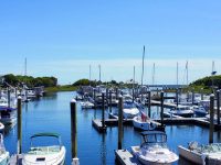 Saquatucket Municipal Marina (top), the Harwich Port harbormaster's office (right), and the view from the author's boat (above).