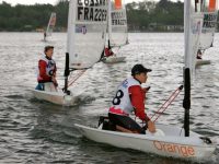 Photo courtesy LVRA/WikipediaThe O'pen Skiff is a boat that kids worldwide love to sail. This regatta, in France, is in light air.