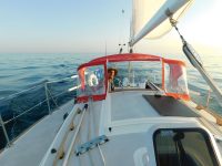 Photo by Diana DonahueThe author at Mojo's helm. The boat's small diesel was a welcome change from the outboard on his last boat.