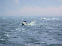 Photo by Joe BerkeleyA stricken Ensign off the coast of Massachusetts. The end of August in New England featured fast-moving, powerful storms.