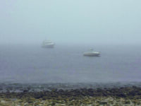 Photo courtesy Tim PlouffTegoak, the author’s 21-foot Sea Ray, at anchor in the fog.