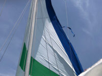 At right, fabric can be seen tearing away from the genoa. More deferred maintenance that was not spotted before the journey began.