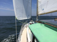 Photos by Albert PresgravesAbove, Magus launched and provisioned. At right, sailing downwind on Chesapeake Bay.