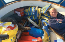 Capt. Nate Birch and his trusty dog, Bill, resting in the launch Delayed Gratification after an exhaustive PFD count.