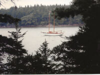 Photo by Phil GodfreyAbove, Great Circle at anchor at one of the islands off Frendship, Maine. At left, Jay in the bosun’s chair.