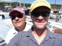 Photo by Bob MugglestonFormer editor Nim Marsh and the author, taking a break from peddling wares at the Wooden Boat Show in Mystic, Conn.