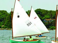 Photo courtesy Michael L. MartelHerb and grandson Oliver sailing Beetle cat #551.