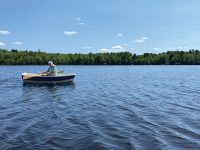 Photo by Clint ChaseNaval architect David Wyman puts the Points East Pram through her paces on the Saco River.