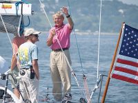 Photo by Sandy MarstersMerle Hallett waves to other boaters during one of the many MS Regattas he organized.