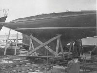 Photos courtesy Patrick BroganAbove, the author, age 6, in the same pipe berth he shared back in City Island with his Dad. This photo was taken later during another cruise. At right, the Herreshoff 23 Flame just before launching.