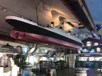Photo courtesy Mark BarrettA 40-foot model of the Titanic hangs over the dance floor at Captain’s Cove Seaport in Bridgeport, Conn.